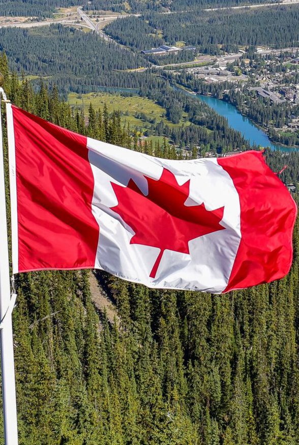 About canada flag with canadian rocky mountain at the ba 2021 11 17 18 47 08 utc scaled e1739867012973